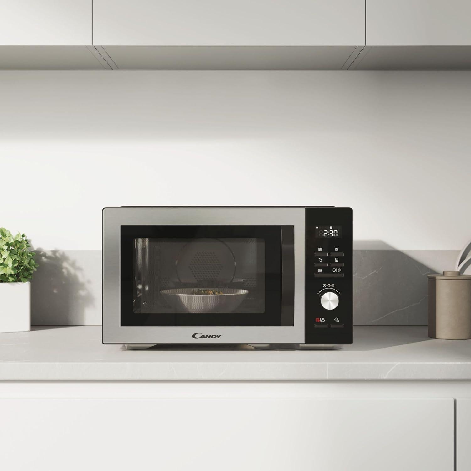 imageCandy CMGA31EDLB Four Microondes Gril Quartz 1000W Grande Capacit 31L Recettes Automatiques Fonction Gril Nettoyage Auto Programmateur digital Fonction dconglation Noir SilverGRIL 31L DIGITAL Noir Argent